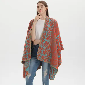 Detail of red and blue vintage jacquard knit shawl with intricate floral patterns
