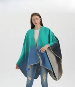 Detail of knitted gradient shawl showing green to navy transition and fine hemmed edges