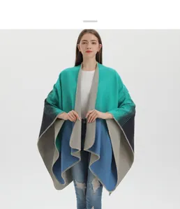 Detailed knit texture of a bohemian gradient poncho with elegant edge stitching detail