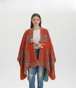 Detail shot of heavy knit shawl with orange fabric and light blue bicycle patterns