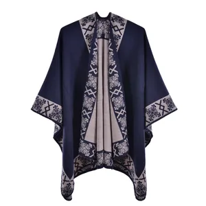 Close-up of ethnic geometric patterns and navy knit texture on the warm shawl