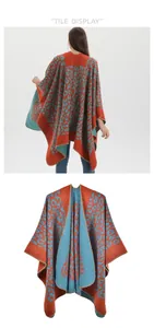 Detail of orange and blue leopard print knit shawl with high-quality edge stitching