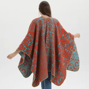 Detailed back view of vintage jacquard shawl with red and teal floral scroll patterns