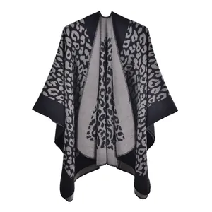 Close-up of leopard print knit shawl in grey and black featuring open front design