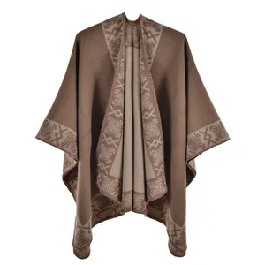Close-up of thick winter shawl featuring vintage geometric patterns and floral textures