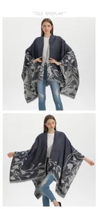 Detail display of navy floral pashmina cape with elegant jacquard patterns and tassels