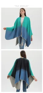 Detail view of ethnic gradient knit poncho with blue-green fringe and chunky texture