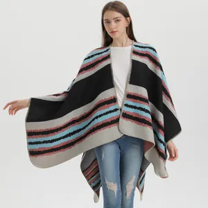 Bohemian striped knit poncho wrap with colorful ethnic patterns and fringed edges