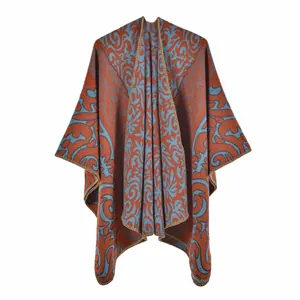 Detail of blue and orange jacquard knit shawl showing intricate vintage patterns and stitching