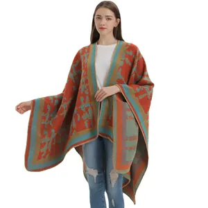Women's orange cashmere-like poncho shawl with vintage colorful geometric patterns