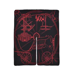 Macro detail of red vintage carriage wheel pattern on thick black knit shawl wrap