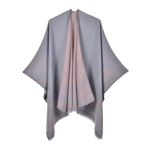 Close-up of split shawl featuring double-sided floral pattern and delicate tassel edge