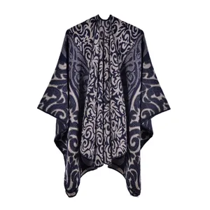 Detail of baroque scroll pattern jacquard weaving on navy blue winter knit shawl