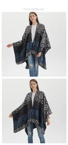 Detail of bohemian geometric pattern on a warm navy and grey knit shawl cape