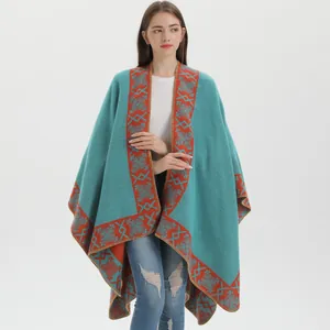 Ethnic knit shawl cloak with geometric snowflake pattern in blue and orange