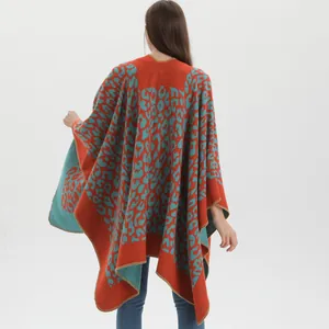 Chic leopard print knitted shawl cape in bold orange and teal color block style