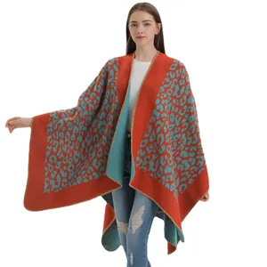 Women's split cape shawl featuring orange and blue leopard knit with soft drape