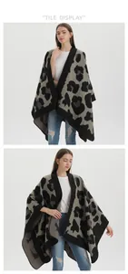 Detail showing knit texture and wide black hem of a leopard print shawl wrap