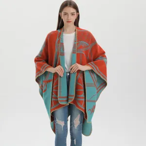 Women's warm winter shawl wrap with abstract geometric knit pattern in orange and blue