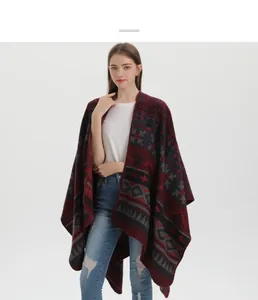 Detail of bohemian knit shawl with ethnic geometric patterns in burgundy and navy