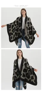 Detail of grey leopard print knitted poncho featuring premium jacquard texture and black border