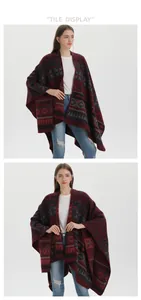 Close-up of red and black bohemian geometric knit pattern on the warm winter poncho