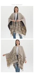 Detail of bohemian knit shawl featuring geometric patterns and fringe trim tassels