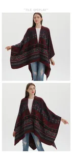 Detail of ethnic geometric knit shawl with elegant drape and bohemian tassel pattern