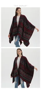 Close-up of geometric ethnic pattern on knitted poncho with soft wool texture