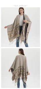 Front and back detail of knitted poncho with bohemian geometric patterns and long fringes