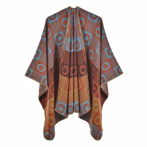 Detailed knit texture of orange and blue geometric pattern shawl with fine edge stitching