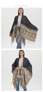 Detail view of boho knit shawl featuring geometric patterns and long fringe accents
