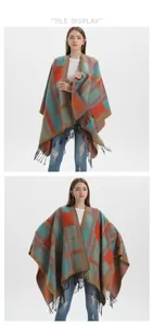 Close-up of bright orange and teal plaid knit shawl featuring detailed black tassel fringe
