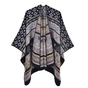 Detailed view of the thick knit texture and geometric patterns on this bohemian shawl