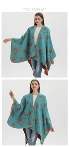Detail view of turquoise knitted poncho featuring orange star and polka dot patterns