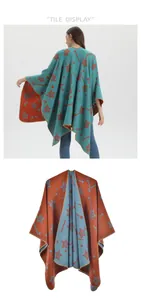 Detail of reversible knitted shawl with orange star patterns on a teal blue base