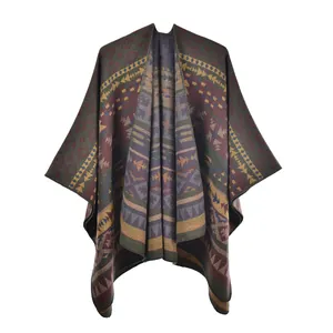 Detailed knit texture of bohemian poncho with geometric patterns and fringe detail