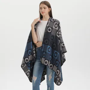 Women knit shawl poncho with geometric stripe pattern in navy blue and grey