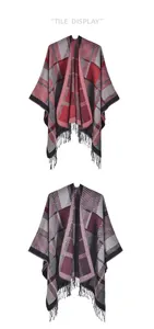 Detail view of winter plaid knit shawl featuring fringed hems and split cape design