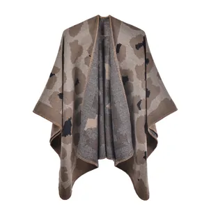 Detailed view of leopard print knit texture and hem stitching on cashmere-like shawl