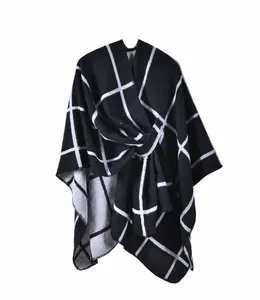 Detail of classic black and white plaid knit shawl with premium fiber texture