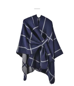 Detail of navy and grey plaid knit shawl with a cross-tie waist and soft texture