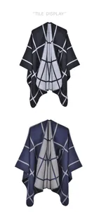 Detail view of double-sided knit ponchos featuring classic contrast plaid patterns