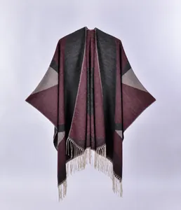 Detail of burgundy and grey geometric pattern shawl with elegant tassel fringe edge
