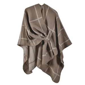 Plaid knitted winter poncho in brown and grey with front tie closure for women