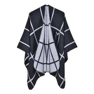 Classic black and white plaid knit poncho wrap with a split front and fringeless edges
