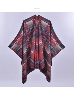Close-up of geometric tribal patterns and thick knit texture on the split shawl