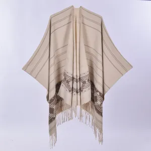 Women's chic beige knitted poncho shawl with bohemian geometric patterns and tassels