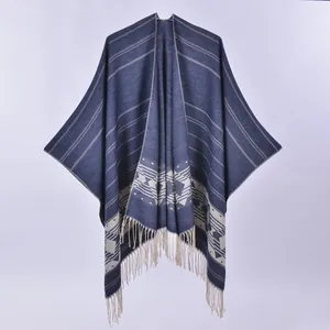 Ethnic style navy blue knit poncho cape with geometric patterns and tassel hem for women