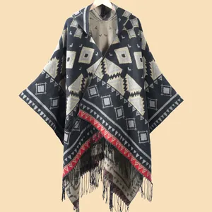 Women's knitted hooded poncho with bohemian geometric patterns and fringe hem details